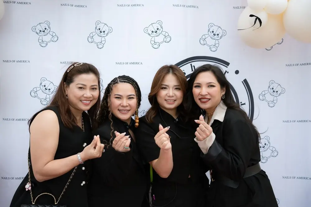 Celebrating with salon owners at a Nails of America event